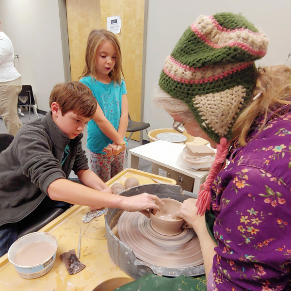 children-woman-making-pottery